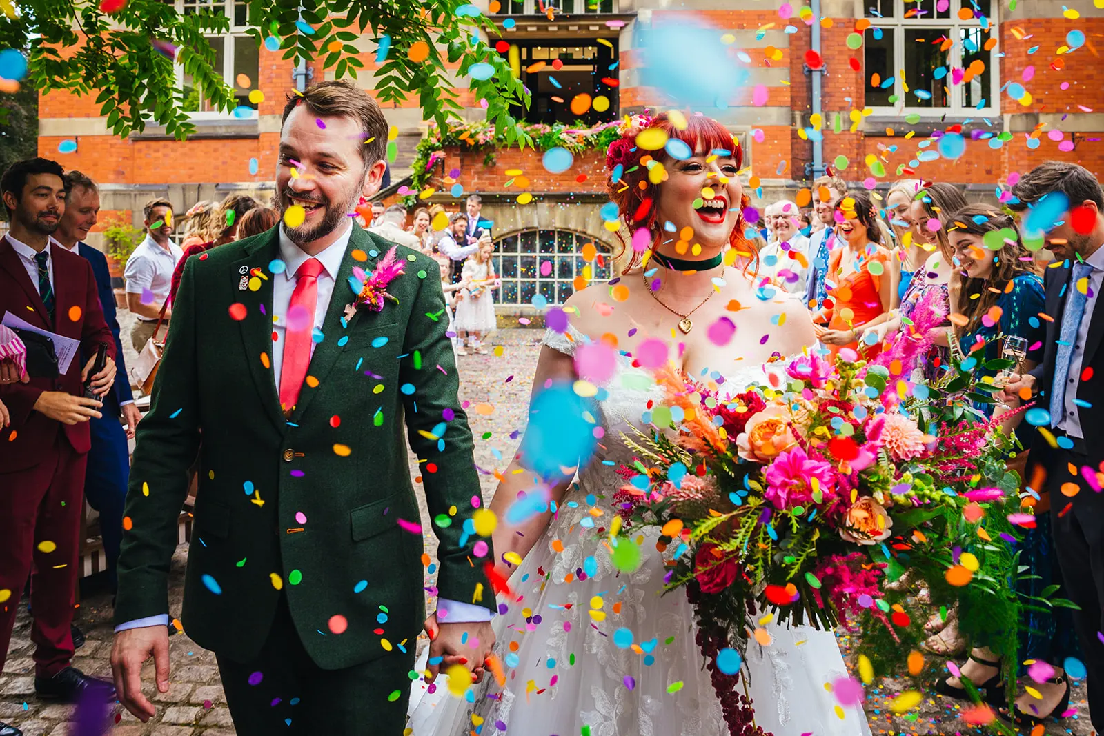Couple walking through confetti at The Pumping House