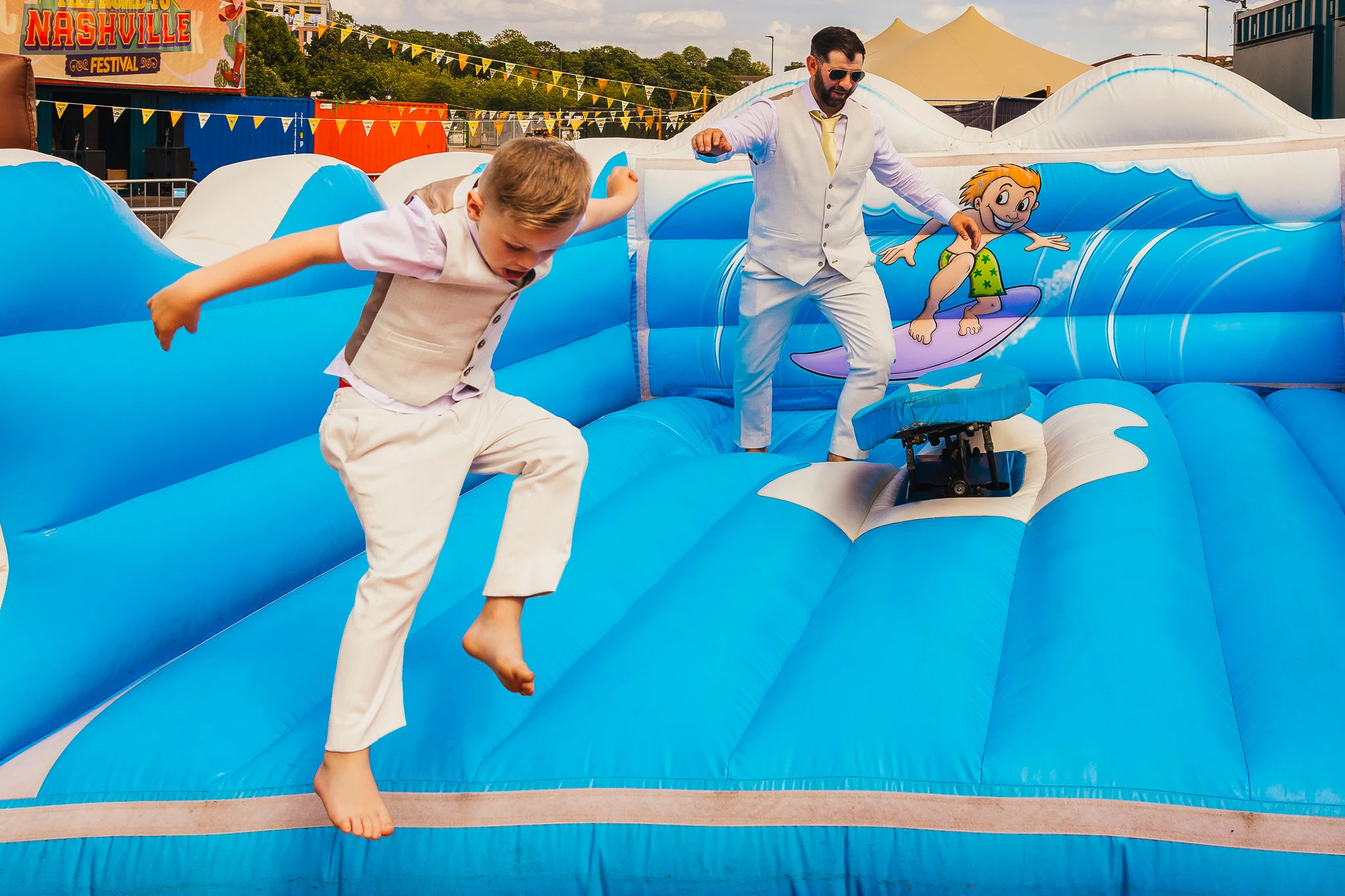 Groom riding a surf simulator at Binks Yard
