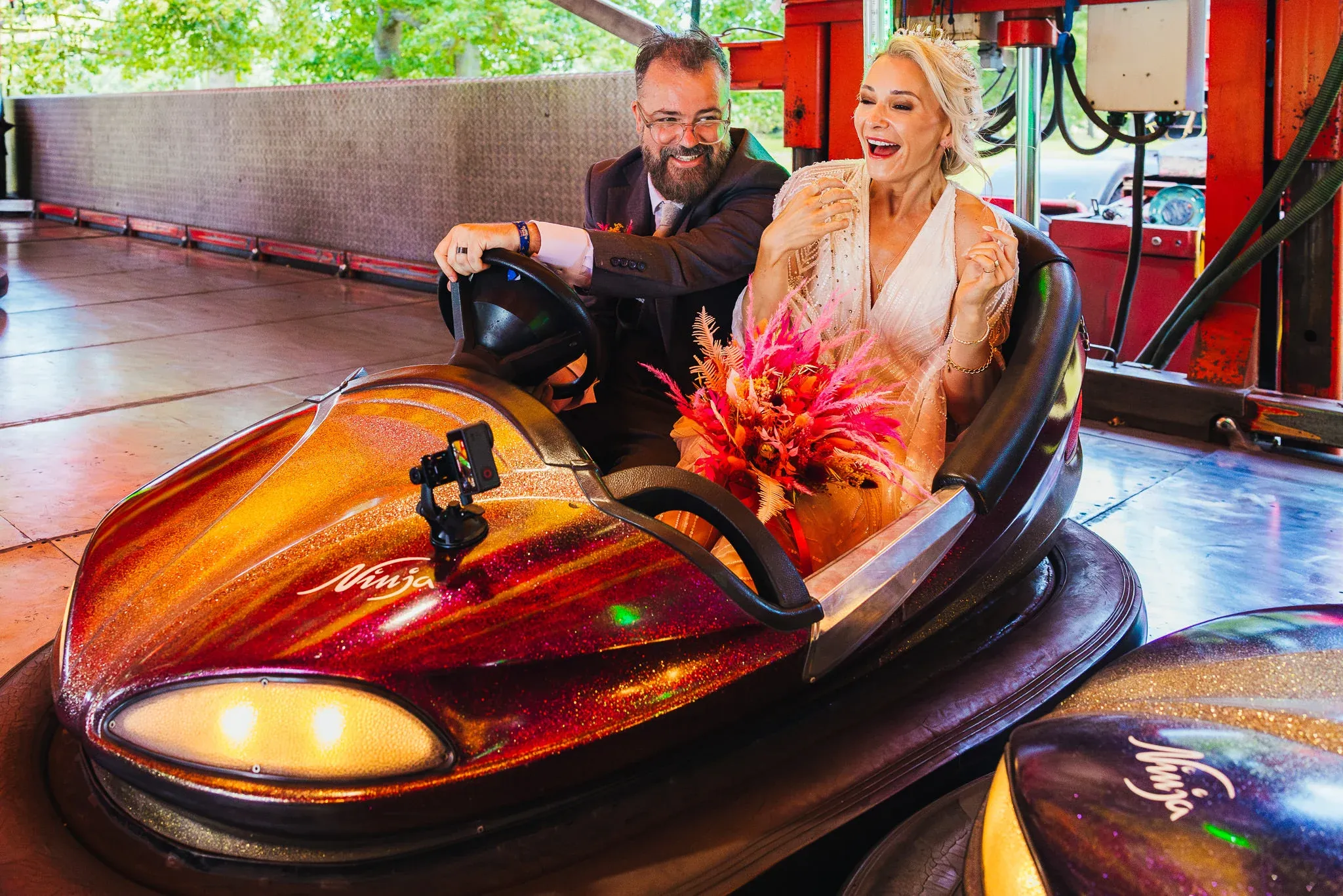 Couple laughing in a glittery bumper car