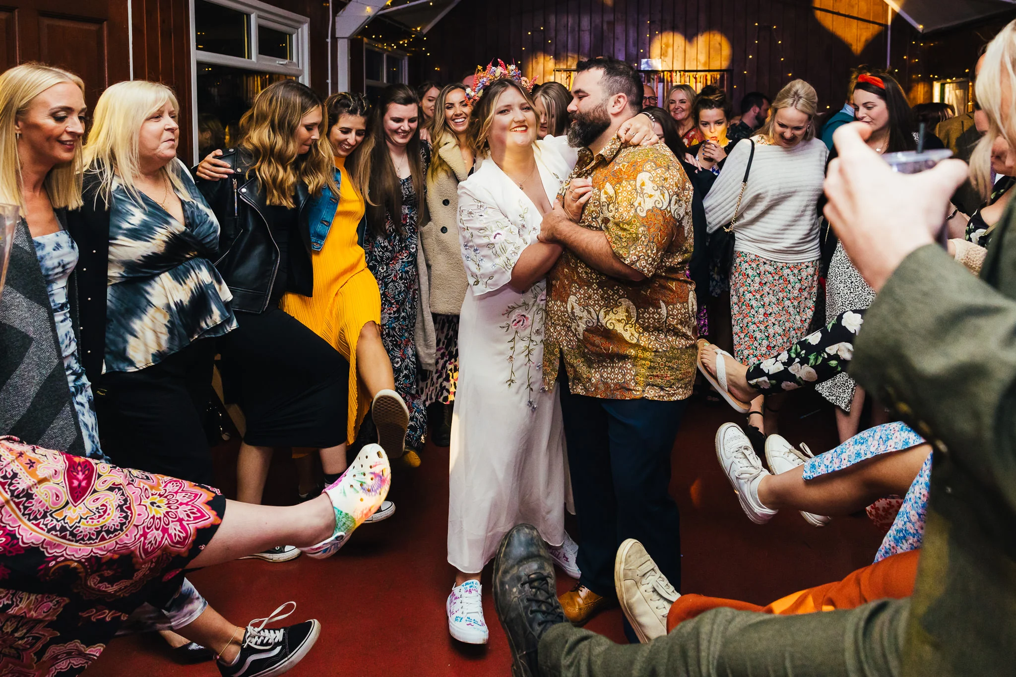 Couple and guests going wild on the dance floor