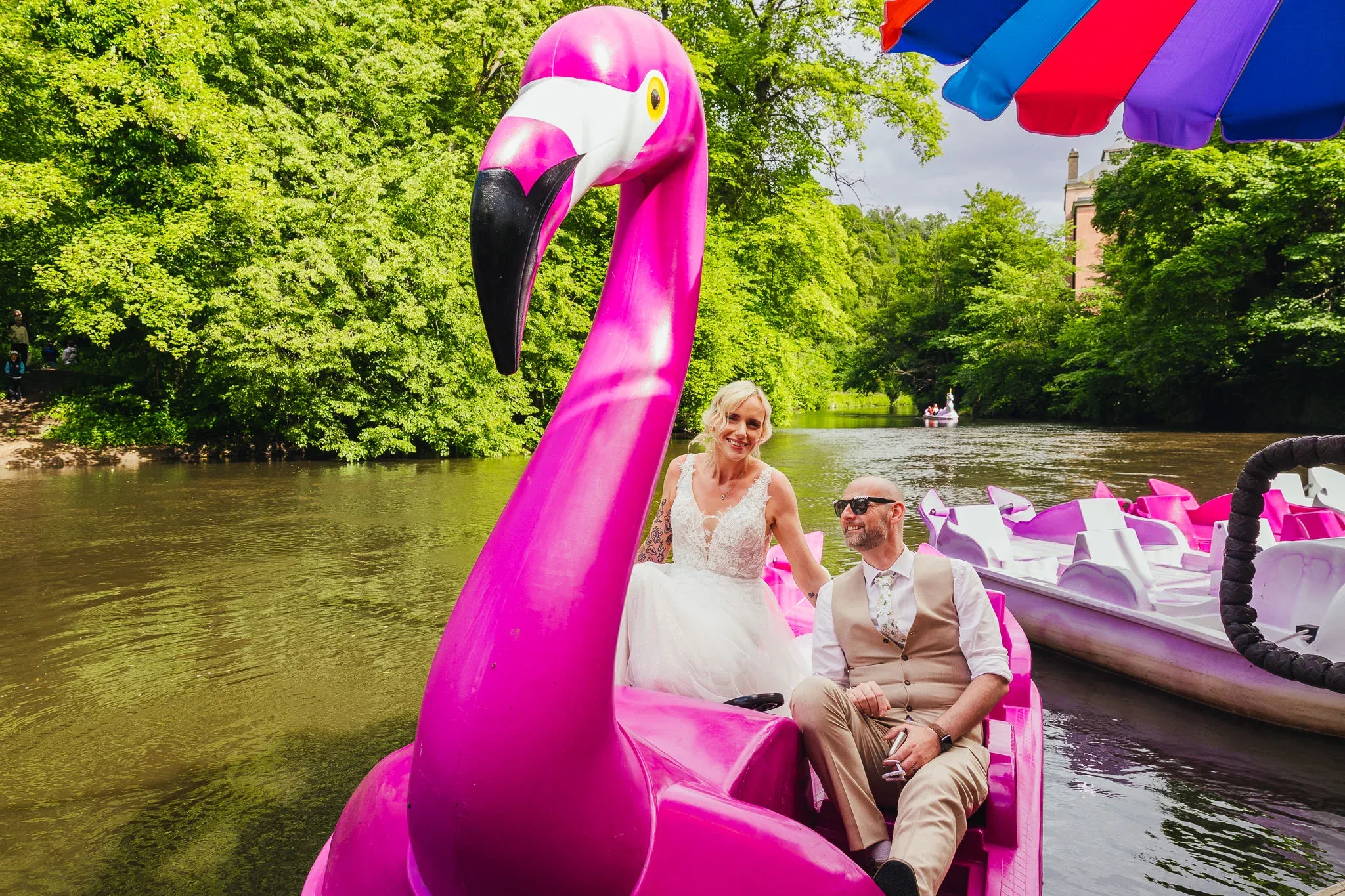 Couple in a flamingo pedalo in Matlock Bath