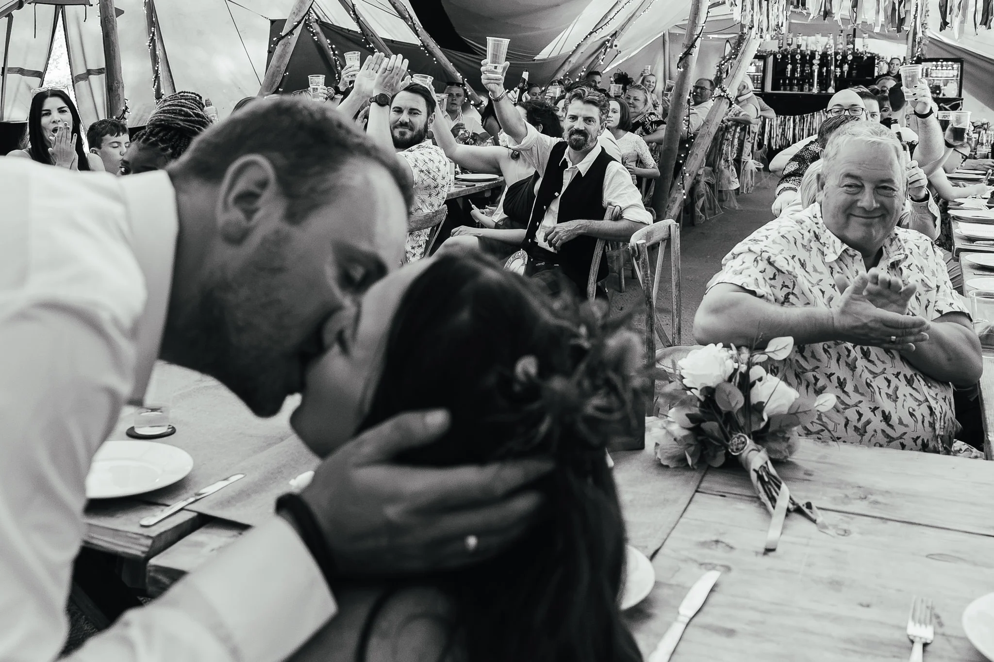 Couple kissing during speeches at The Old Vicarage