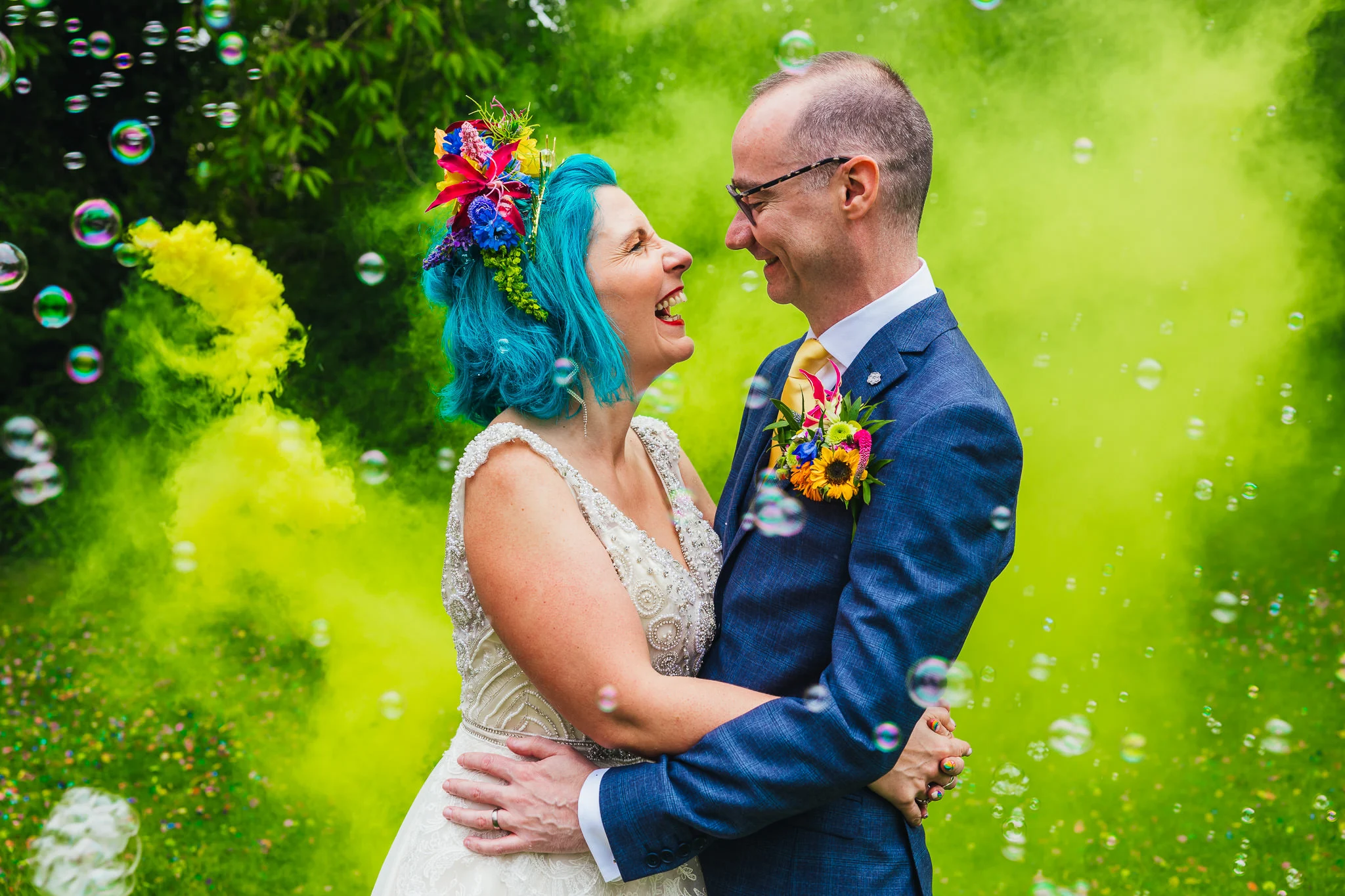 Couple laughing in smoke and bubbles