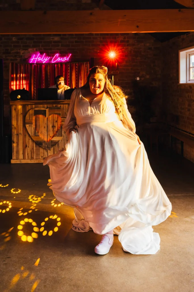 Bride dancing at The Old Cow Shed