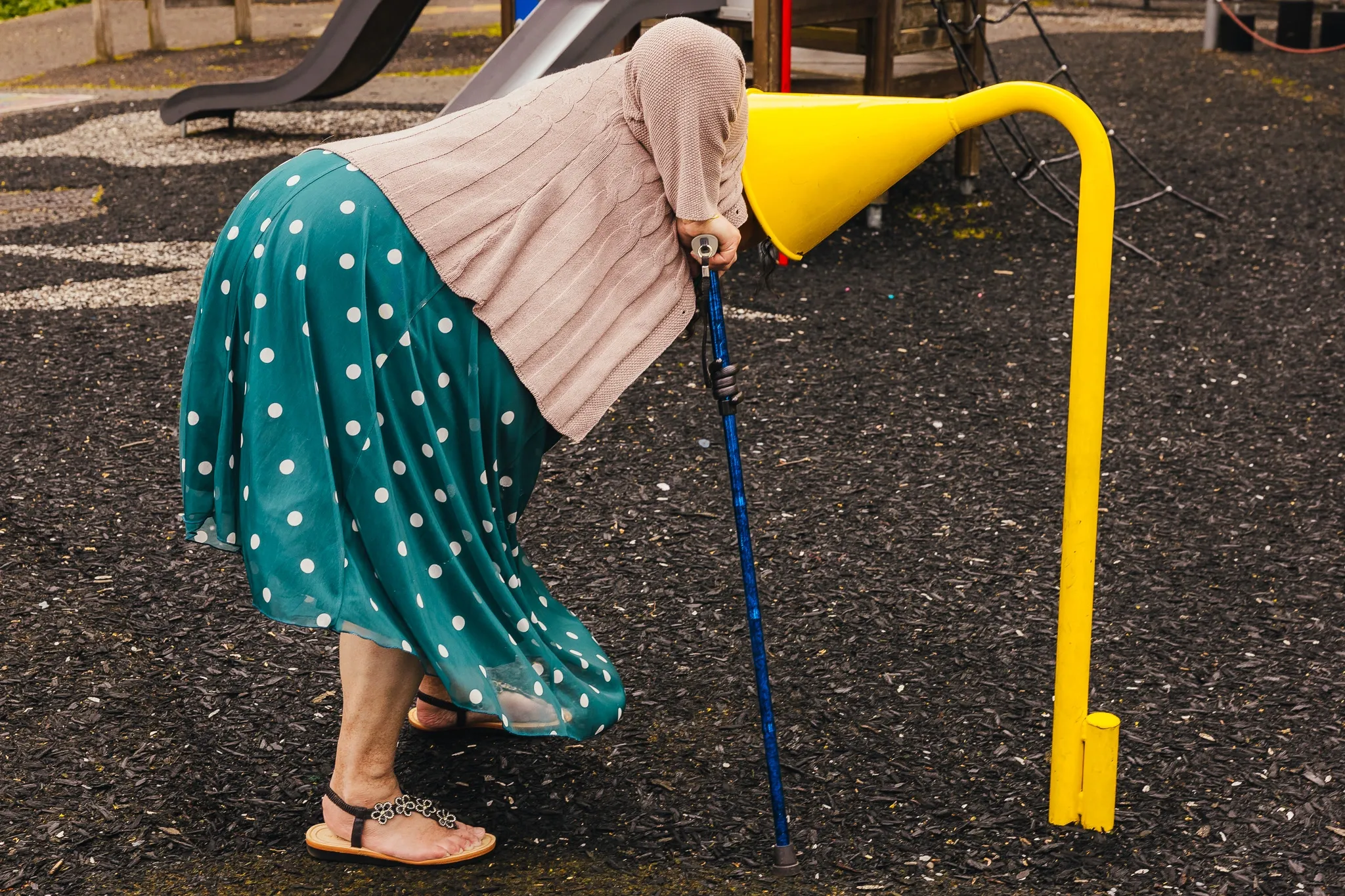 Guest with her head in a yellow listening funnel at Arnot Hill House