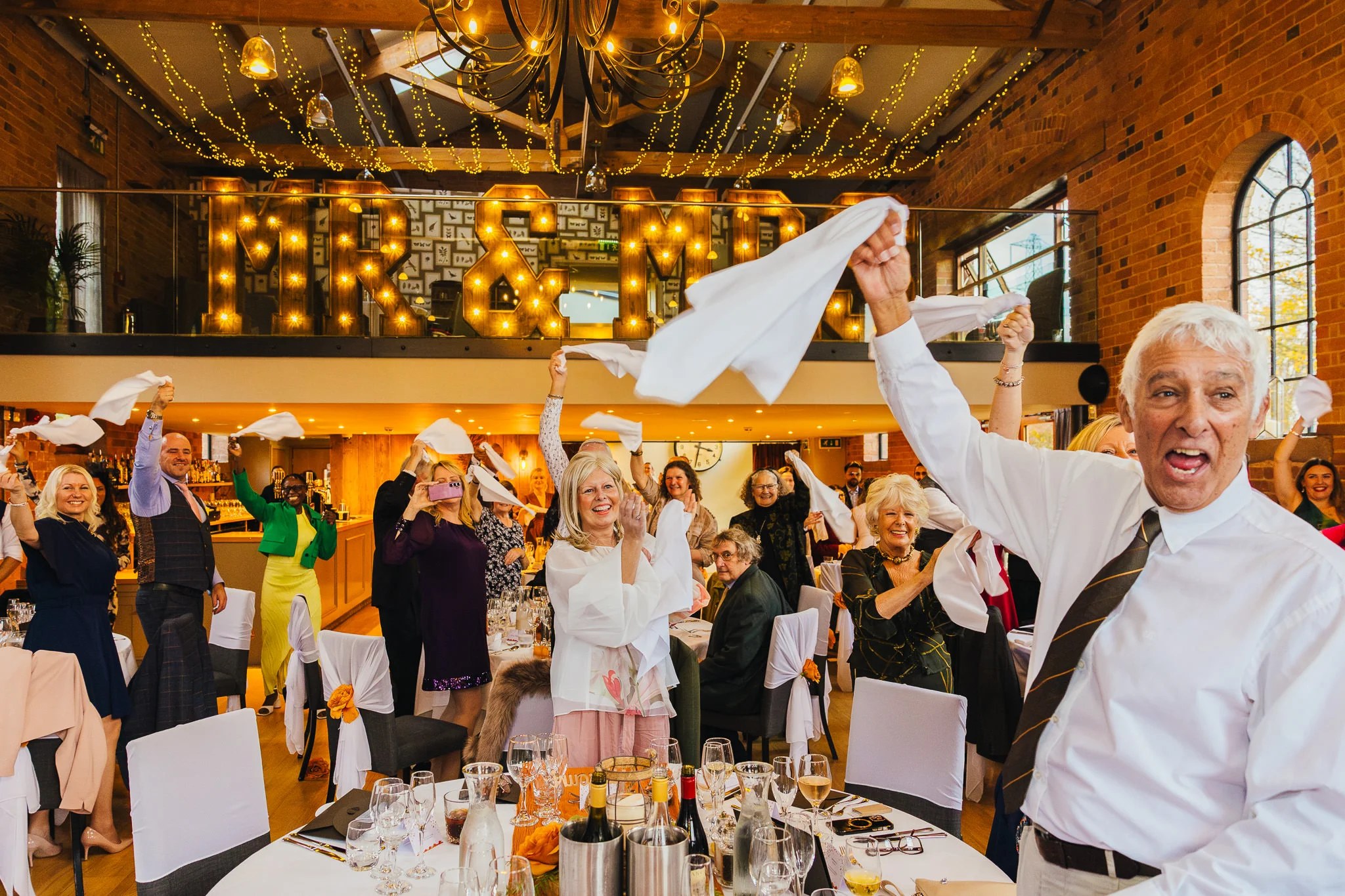 Guests waving napkins at Carriage Hall