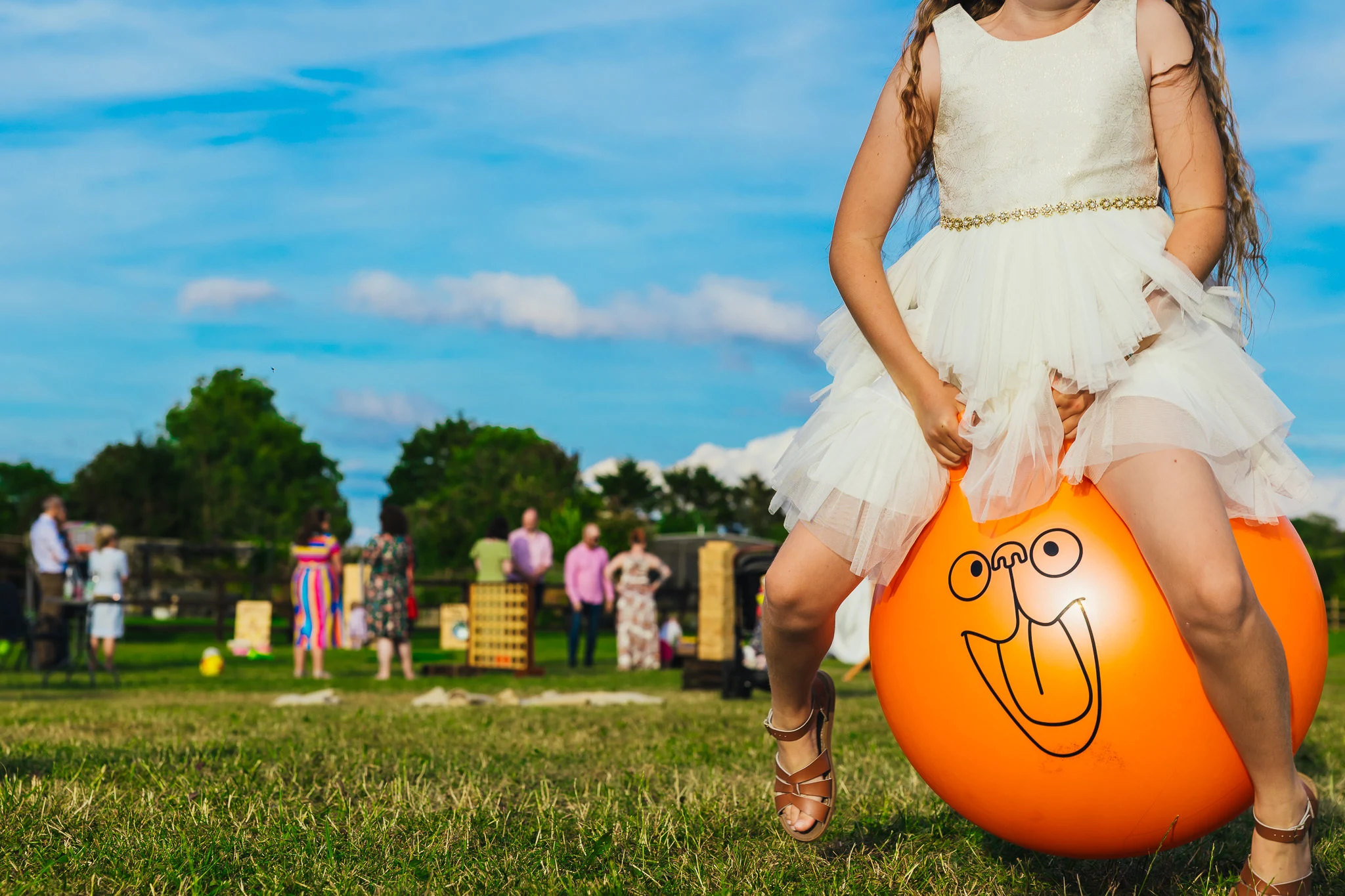 Guest on a space hopper on the lawn